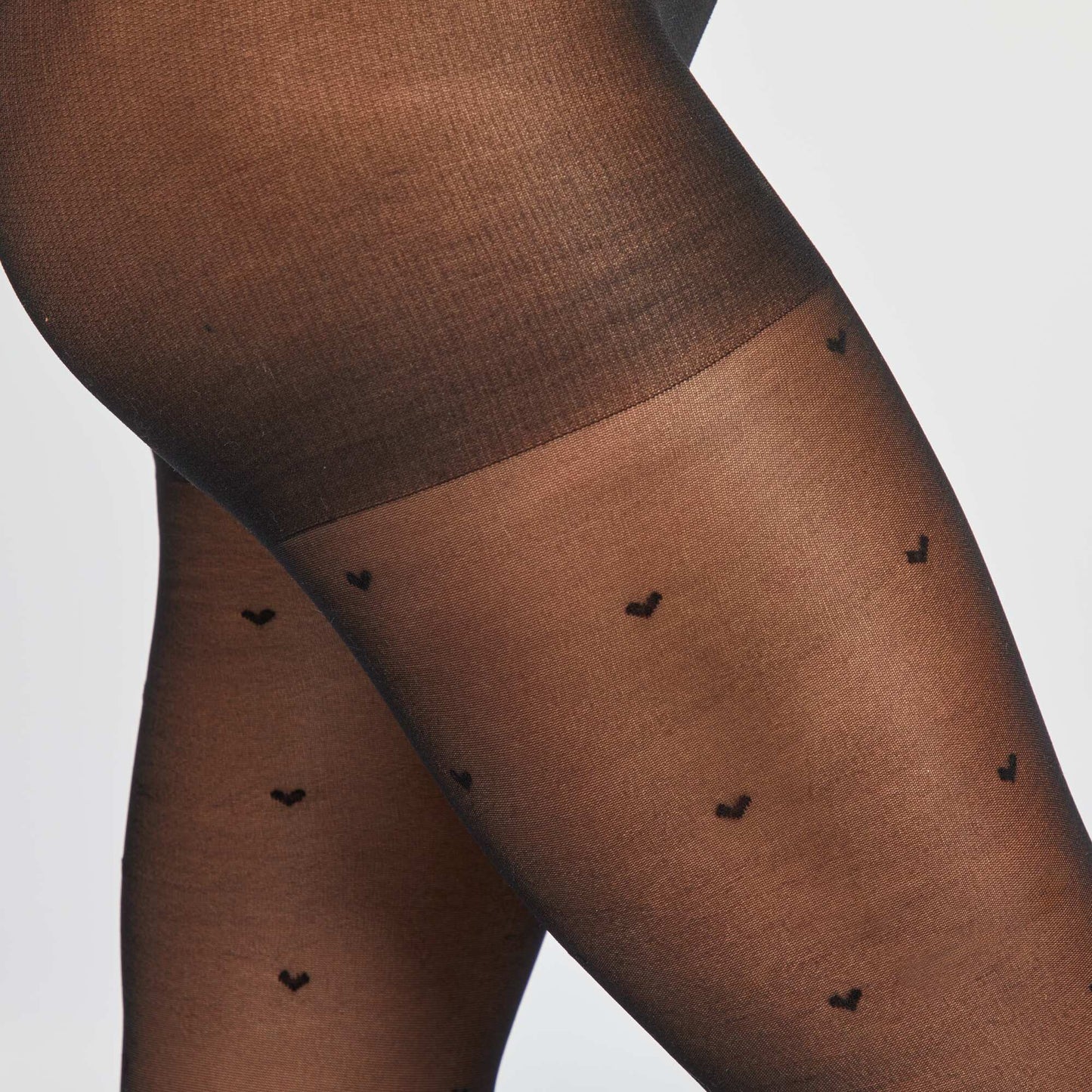 Collants plumetis à cœur noir